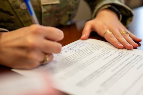 Airman writes out information