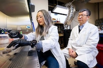 Tiffany Hennessa (left), Ph.D., U.S. Naval Research Laboratory (NRL) research biologist, and Zheng Wang, Ph.D., NRL research biologist, analyze a microbial sample in Washington, D.C., Jan. 9, 2026. Scientists at NRL sent microbial samples aboard the International Space Station to investigate how microgravity affects microbial metabolism and biomaterial production. (U.S. Navy photo by Sarah Peterson)