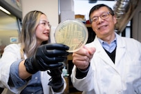 Tiffany Hennessa (left), Ph.D., U.S. Naval Research Laboratory (NRL) research biologist, and Zheng Wang, Ph.D., NRL research biologist, analyze a microbial sample in Washington, D.C., Jan. 9, 2026. Scientists at NRL sent microbial samples aboard the International Space Station to investigate how microgravity affects microbial metabolism and biomaterial production. (U.S. Navy photo by Sarah Peterson)