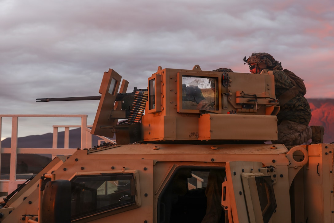 U.S. Marine Corps Sgt. Andrew Montpetit, a machine gunner with 3rd Littoral Combat Team, 3rd Marine Littoral Regiment, 3rd Marine Division, adjusts fire on a M2 .50 caliber mounted machine gun from a Joint Light Tactical Vehicle during a live-fire training event at Pohakuloa Training Area, Hawaii.