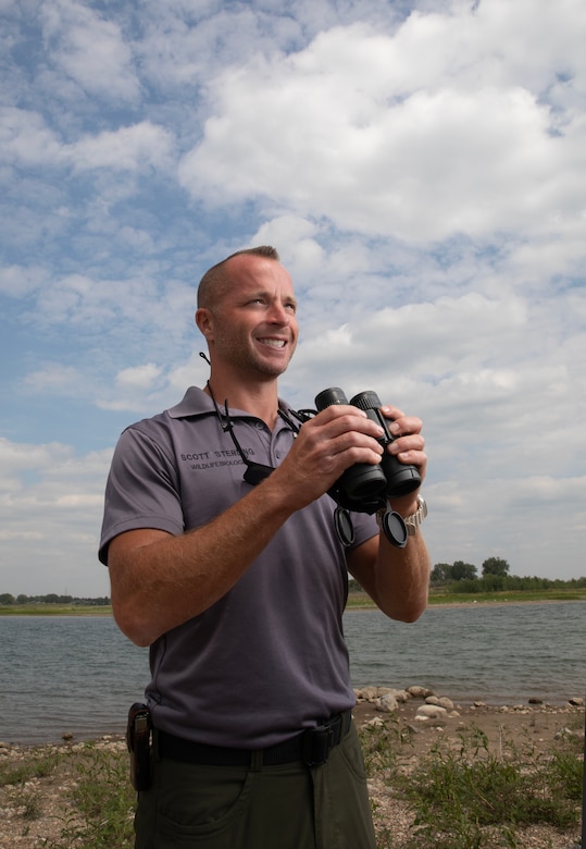 Scott Sterling, a natural resources specialist and park ranger with the U.S. Army Corps of Engineers, Omaha District’s Garrison Project in North Dakota, poses for a photo after watching the shoreline for piping plovers, July 17, 2025.