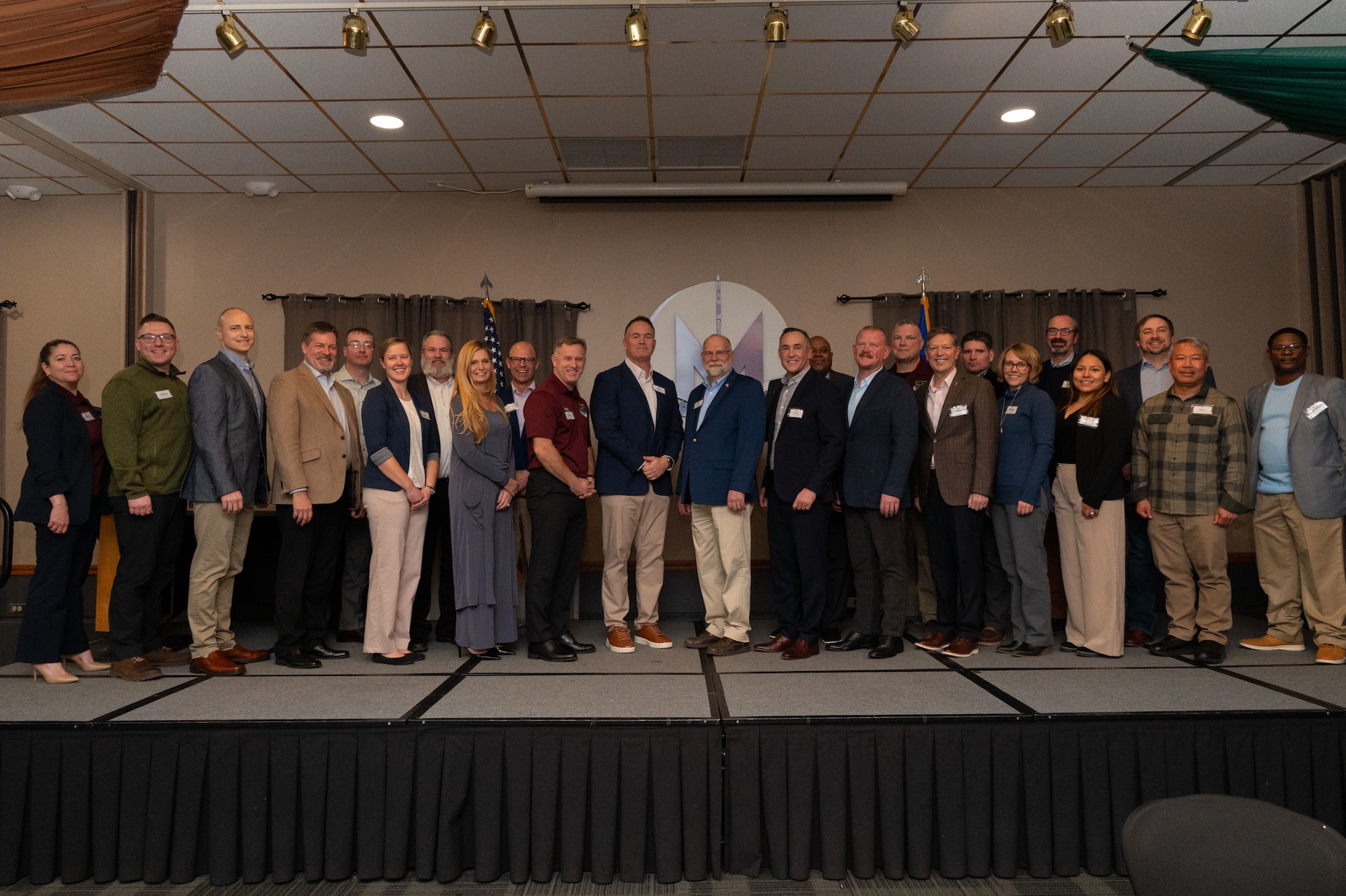 Team Minot leadership and local community leaders pose for a group photo during an Honorary Commander Induction Ceremony at Minot Air Force Base, North Dakota, Jan. 16, 2026. The Honorary Commander program strengthens relationships between the installation and surrounding community by fostering mutual understanding and partnership. (U.S. Air Force photo by Airman 1st Class Vincent Padilla)