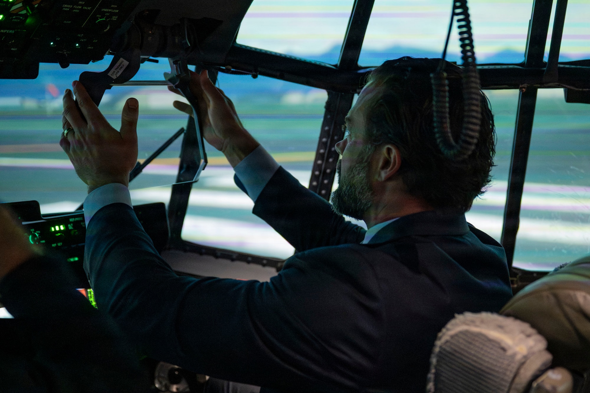 Under Secretary of the Air Force Matt Lohmeier adjusts a head-up display while in an HC-130J Combat King II aircraft simulator at Davis-Monthan Air Force Base, Arizona, Jan. 21, 2026. The hands-on simulator experience demonstrated to Lohmeier DM’s advanced capabilities in preparing pilots for operational missions. (U.S. Air Force photo by Airman 1st Class Samantha Melecio)