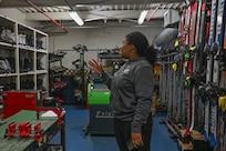 outdoor recreation staff helps with winter rentals