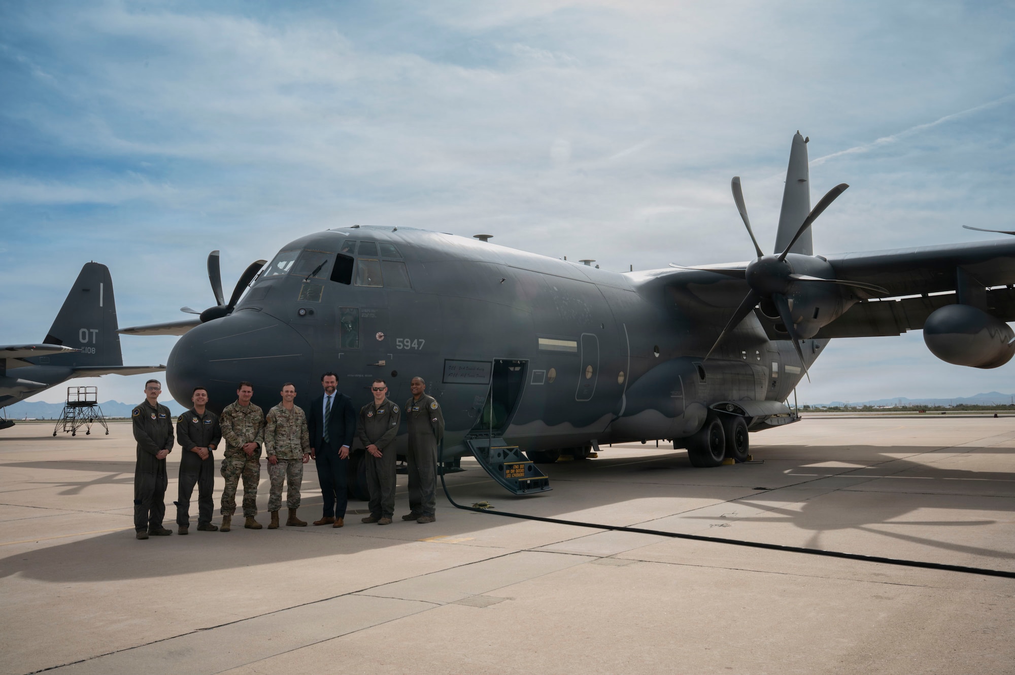 Under Secretary of the Air Force Matt Lohmeier and members of the 563rd Rescue Group pose for a photo in front of an HC-130J Combat King II aircraft at Davis-Monthan Air Force Base, Arizona, Jan. 21, 2026. Lohmeier was briefed on the HC-130J’s mission capabilities and its role in supporting Air Force readiness and lethality. (U.S. Air Force photo by Airman 1st Class Samantha Melecio)