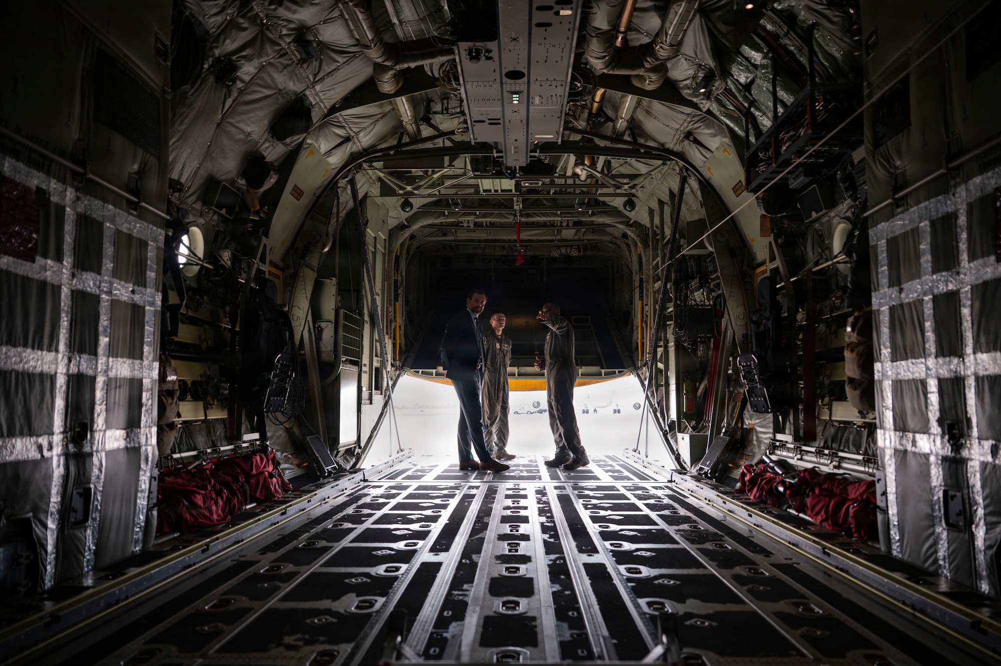 Under Secretary of the Air Force Matt Lohmeier is briefed by U.S. Air Force Staff Sgt. Gregory Jackson and Senior Airman Ian Cosper, assigned to the 79th Rescue Squadron, on the HC-130J Combat King II aircraft and its mission capabilities at Davis-Monthan Air Force Base, Arizona, Jan. 21, 2026. Lohmeier toured the aircraft and learned how its different components contribute to operational effectiveness. (U.S. Air Force photo by Airman 1st Class Samantha Melecio)