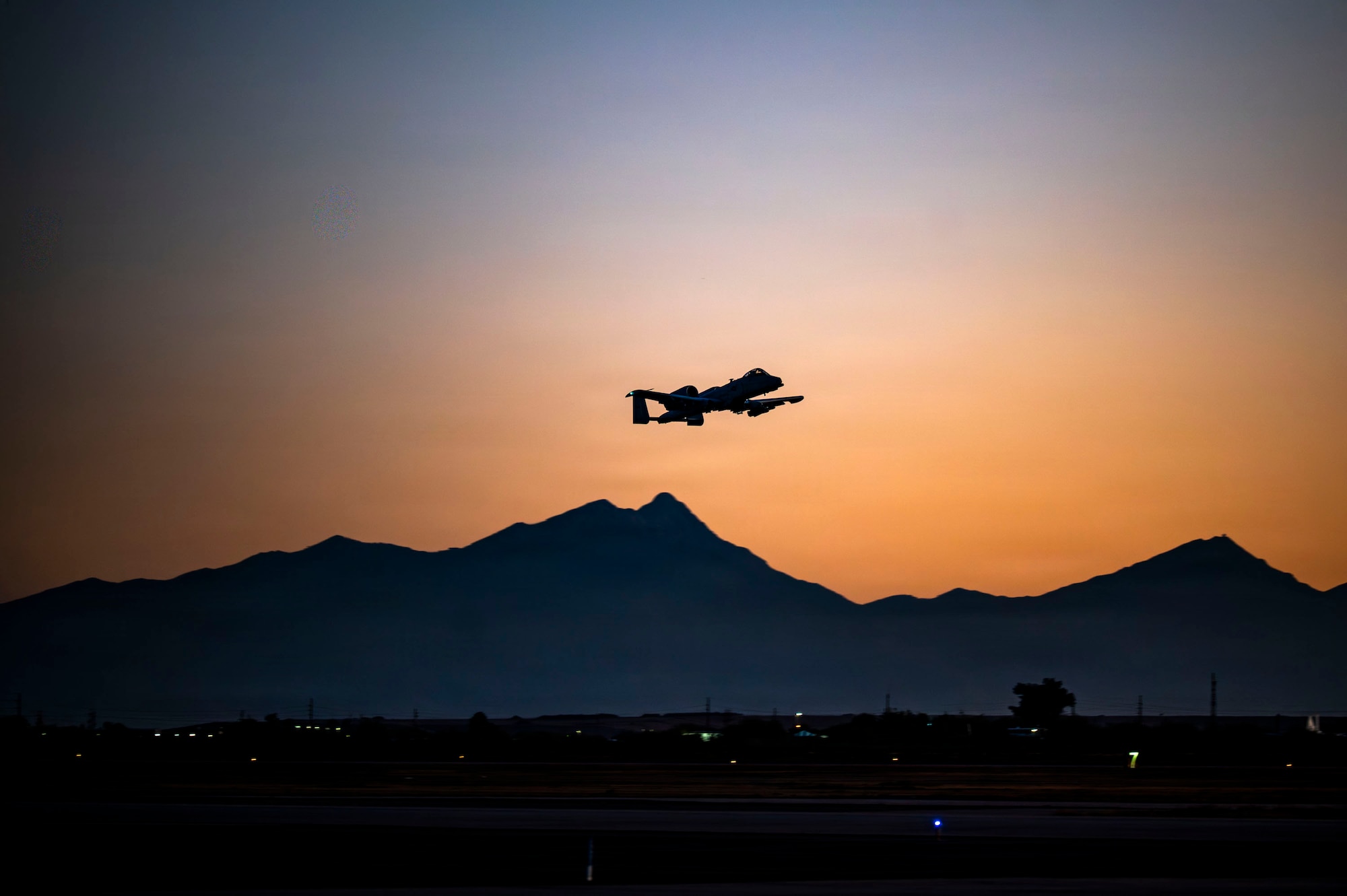 U.S. Air Force 1st Lt. Brayden Mathis, 357th Fighter Squadron A-10C Thunderbolt II aircraft student pilot, takes flight in an A-10 aircraft over Davis-Monthan Air Force Base, Arizona, Dec. 16, 2025. Mathis was the last student to execute a night sortie from the 357th FS, nicknamed the Dragons. (U.S. Air Force photo by Airman 1st Class Samantha Melecio)