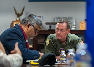 U.S. Air Force Lt. Col. Edmund A. Ballew, Air Command and Staff College vice commandant, reviews an Air Command and Staff College yearbook with Retired Bangladesh Air Force Group Capt. Dr. Mohammad Zahidul Islam Khan at Maxwell Air Force Base, Alabama, Jan. 15, 2026.