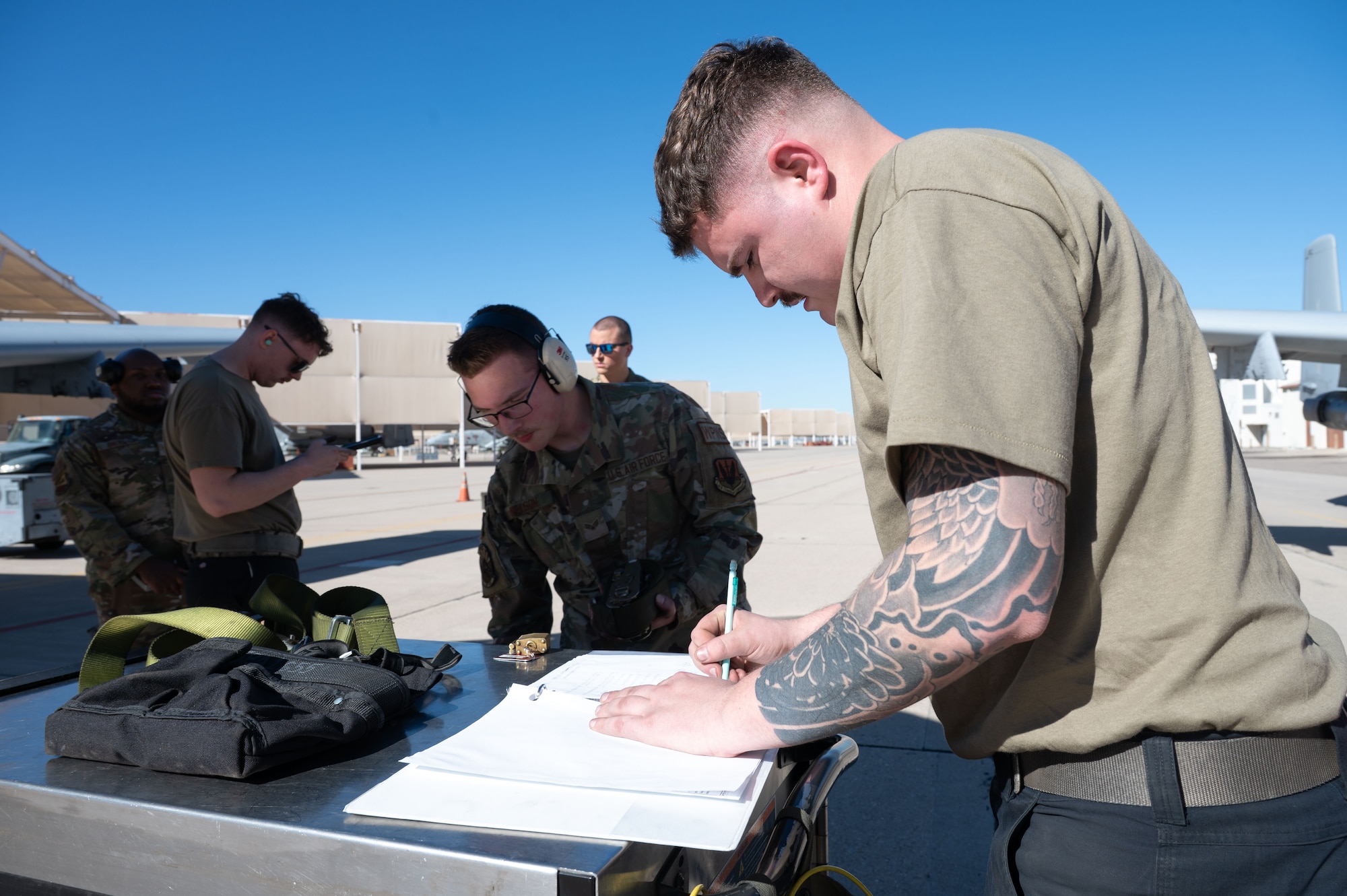 U.S. Air Force Senior Airman Gavin Gonzalez, 357th Fighter Generation Squadron weapons load crew member, finishes the 2025 Load Competition of the Year at Davis-Monthan Air Force Base, Arizona, Jan. 16, 2026. The 357th FGS tests mission readiness through participating in load competitions where they evaluate the ability of weapons load crews to safely and efficiently load munitions while adhering to technical orders and USAF instructions. (U.S. Air Force photo by Airman 1st Class Jaden Kidd)