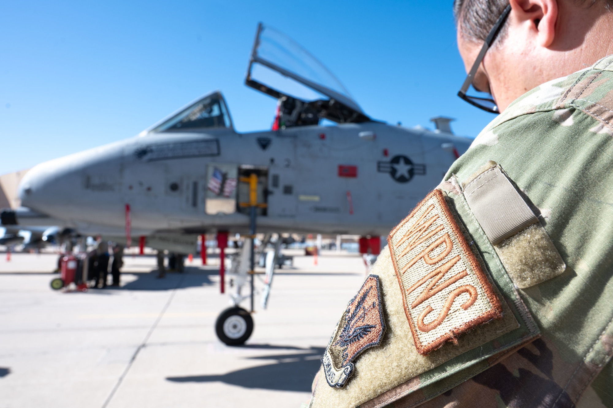 U.S. Air Force Tech. Sgt. Curtis Walters, 355th Maintenance Group weapons expediter, grades a weapons load crew during the 2025 Load Competition of the Year at Davis-Monthan Air Force Base, Arizona, Jan. 16, 2026. Airmen competing in the load competition were judged on their speed and accuracy while loading, a written test on loading procedure and a full service dress inspection to ensure full mission readiness. (U.S. Air Force photo by Airman 1st Class Jaden Kidd)