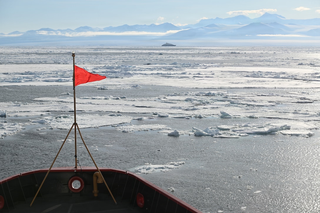 USCGC Polar Star (WAGB 10) approaches an Australian-owned cruise ship stuck in the ice in the Ross Sea after the cutter was requested for assistance on the Polar Star’s 50th birthday amid Operation Deep Freeze 2026, Jan. 17, 2026. Every year, a joint and total force team works together to ensure successful Operation Deep Freeze operations. Active, Guard, and Reserve service members from the U.S. Air Force, Army, Coast Guard, and Navy work together to forge a strong JTF-SFA that continues the proud tradition of U.S. military support to the United States Antarctic Program. (U.S. Coast Guard photo by Petty Officer 2nd Class Christopher Bokum)