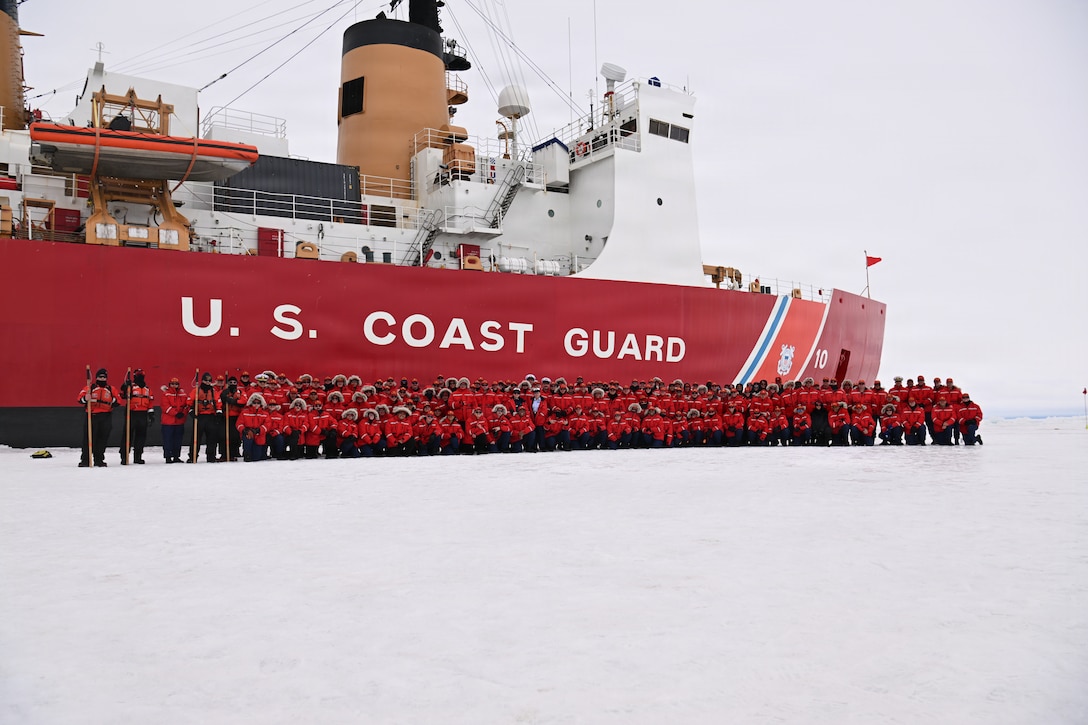 USCGC Polar Star (WAGB 10) crew members pose for a group photo while the cutter sits hove-to in the Ross Sea during Operation Deep Freeze 2026, Jan. 12, 2026. The cutter turns 50 years old on Jan. 17, 2026 amid Operation Deep Freeze, which is a joint service, inter-agency support operation for the National Science Foundation that manages the United States Antarctic Program. (U.S. Coast Guard photo by Petty Officer 2nd Class Christopher Bokum)