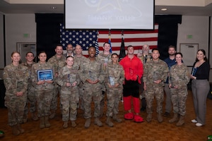 Space Launch Delta 30 members pose for a group photo after receiving awards at the 3rd and 4th quarter award ceremony.