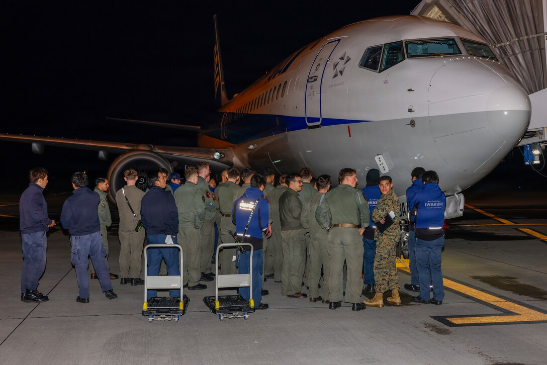U.S. Marines with Aircraft Rescue and Firefighting, Headquarters and Headquarters Squadron (HHS), Marine Corps Air Station Iwakuni, with Marine Corps Air Station Iwakuni Fire and Emergency Services, participate in a Boeing 737-800 aircraft familiarization course at Iwakuni Airport Terminal, Japan, Jan. 8, 2026. MCAS Iwakuni is unique among Marine Corps Installations because of the dual use commercial airport that shares the runway. (U.S. Marine Corps photo by Lance Cpl. Isaac De Leon)