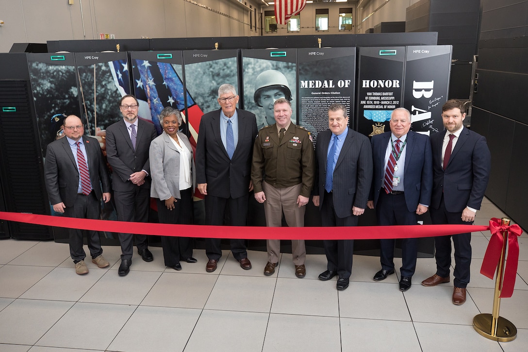 Leaders stand in front of Barfoot
