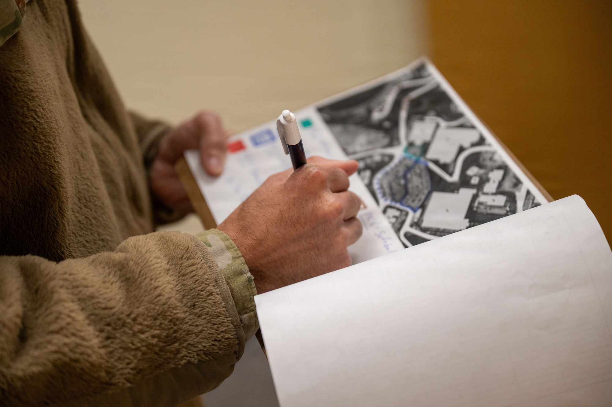 U.S. Air Force Staff Sgt. Anthony Pena, 51st Fighter Wing occupational safety technician, refers to a base map at Osan Air Base, Republic of Korea, Jan. 22, 2026. As an occupational safety technician, Pena’s duties range from conducting inspections, documenting mishaps, assisting investigations, and ensuring members of Team Osan are performing their jobs in safe work conditions.