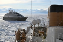USCGC Polar Star (WAGB 10) escorts an Australian -owned cruise ship out of pack ice in the Ross Sea after the vessel requested assistance amid Operation Deep Freeze 2026, Jan. 17, 2026. Pacific Air Forces operates on a 24-hour basis to provide the U.S. National Science Foundation complete joint operational and logistic support for Operation Deep Freeze. (U.S. Coast Guard photo by Petty Officer 2nd Class Christopher Bokum)