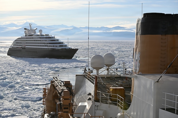 USCGC Polar Star (WAGB 10) escorts an Australian -owned cruise ship out of pack ice in the Ross Sea after the vessel requested assistance amid Operation Deep Freeze 2026, Jan. 17, 2026. Pacific Air Forces operates on a 24-hour basis to provide the U.S. National Science Foundation complete joint operational and logistic support for Operation Deep Freeze. (U.S. Coast Guard photo by Petty Officer 2nd Class Christopher Bokum)