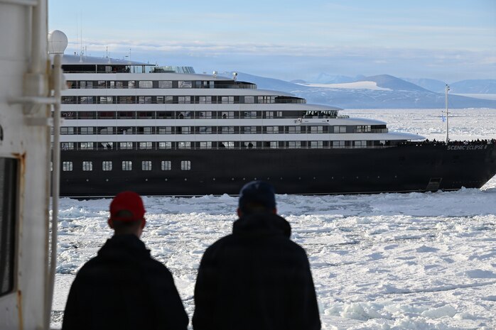 USCGC Polar Star (WAGB 10) crew members view an Australian-owned cruise ship stuck in ice along the Ross Sea, Jan. 17, 2026, while supporting the National Science Foundation in Antarctica. The U.S. National Science Foundation is the U.S. Government agency that promotes the progress of science, funds and manages the Antarctic Program. (U.S. Coast Guard photo by Petty Officer 2nd Class Christopher Bokum)