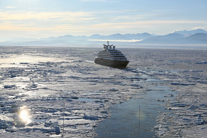 USCGC Polar Star (WAGB 10) escorts an Australian-owned cruise ship out of pack ice in the Ross Sea after the vessel requested assistance amid Operation Deep Freeze 2026, Jan. 17, 2026. Pacific Air Forces operates on a 24-hour basis to provide the U.S. National Science Foundation complete joint operational and logistic support for Operation Deep Freeze. (U.S. Coast Guard photo by Petty Officer 2nd Class Christopher Bokum)