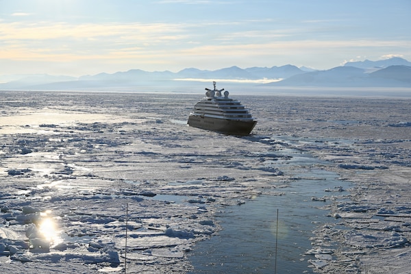 USCGC Polar Star (WAGB 10) escorts an Australian-owned cruise ship out of pack ice in the Ross Sea after the vessel requested assistance amid Operation Deep Freeze 2026, Jan. 17, 2026. Pacific Air Forces operates on a 24-hour basis to provide the U.S. National Science Foundation complete joint operational and logistic support for Operation Deep Freeze. (U.S. Coast Guard photo by Petty Officer 2nd Class Christopher Bokum)