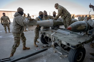 U.S. Air Force Airmen assigned to the 51st Munitions Squadron prepare munitions during the Annual Bomb Build and Loading Competition at Osan Air Base, Republic of Korea, Jan. 22, 2026.