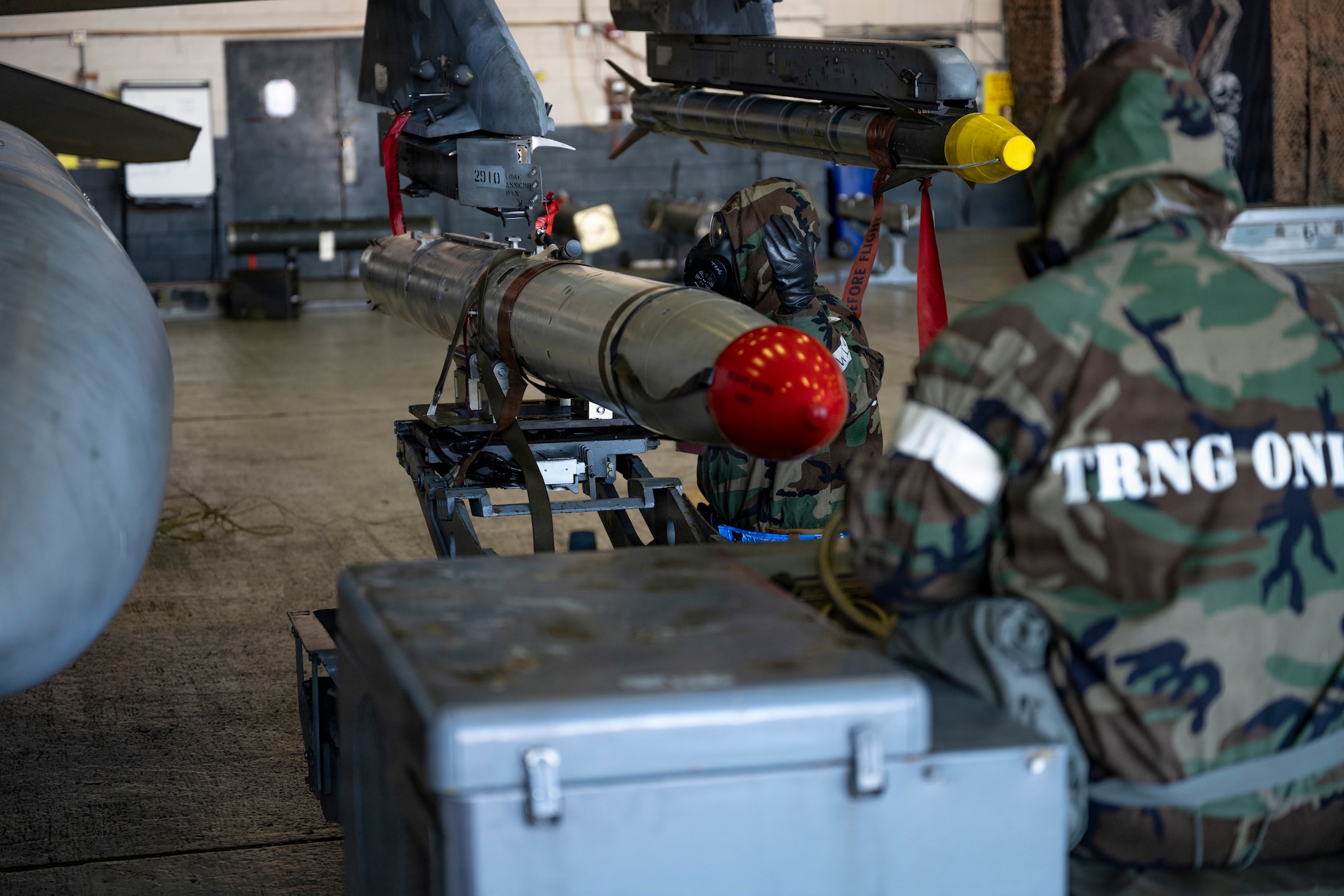 U.S. Air Force Airmen assigned to the 35th Fighter Generation Squadron load munitions into an F-16 Fighting Falcon during the Annual Bomb Build and Loading Competition at Osan Air Base, Republic of Korea, Jan. 22, 2026.