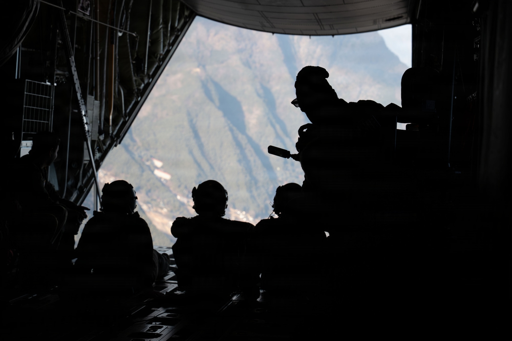 Airmen ride in aircraft