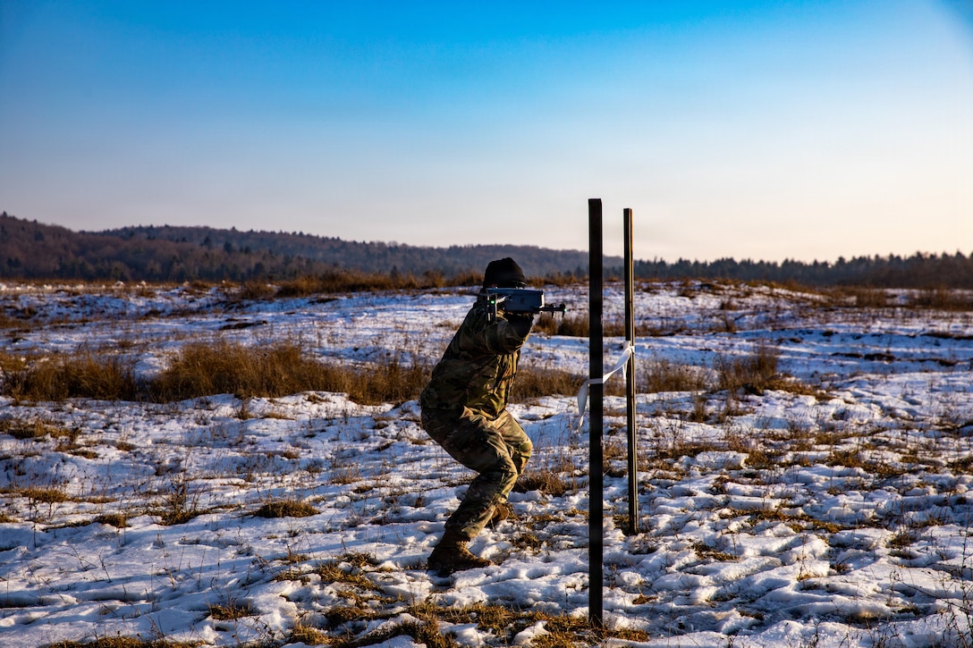 U.S. Soldiers assigned to 1st Battalion, 4th Infantry Regiment, Joint Multinational Readiness Center, operate a small unmanned aircraft system during the Drone Validation Course at the JMRC in Hohenfels, Germany, Jan. 21, 2026. The course trains opposing forces Soldiers to employ reconnaissance and first-person view drone capabilities to replicate modern battlefield threats during rotational training. (U.S. Army photo by Spc. Adrian Greenwood)
