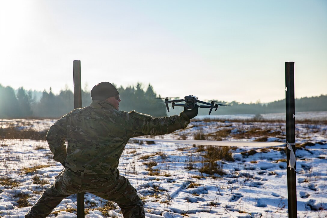 U.S. Soldiers assigned to 1st Battalion, 4th Infantry Regiment, Joint Multinational Readiness Center, operate a small unmanned aircraft system during the Drone Validation Course at the JMRC in Hohenfels, Germany, Jan. 21, 2026. The course trains opposing forces Soldiers to employ reconnaissance and first-person view drone capabilities to replicate modern battlefield threats during rotational training. (U.S. Army photo by Spc. Adrian Greenwood)