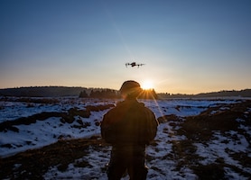 U.S. Soldiers assigned to 1st Battalion, 4th Infantry Regiment, Joint Multinational Readiness Center, operate a small unmanned aircraft system during the Drone Validation Course at the JMRC in Hohenfels, Germany, Jan. 21, 2026. The course trains opposing forces Soldiers to employ reconnaissance and first-person view drone capabilities to replicate modern battlefield threats during rotational training. (U.S. Army photo by Spc. Adrian Greenwood)