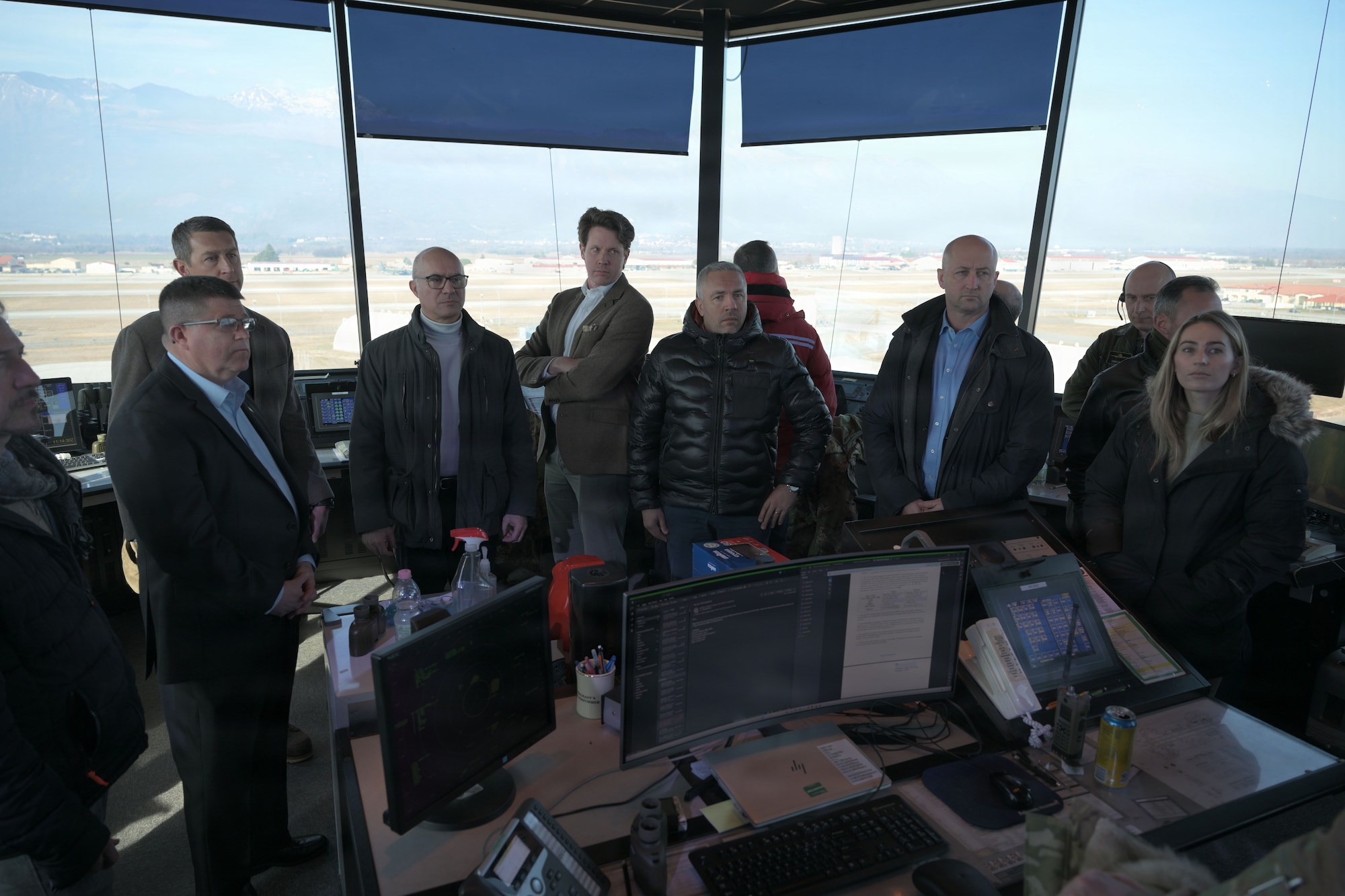 Members of the Joint Military Commission take a tour of the air traffic control tower.
