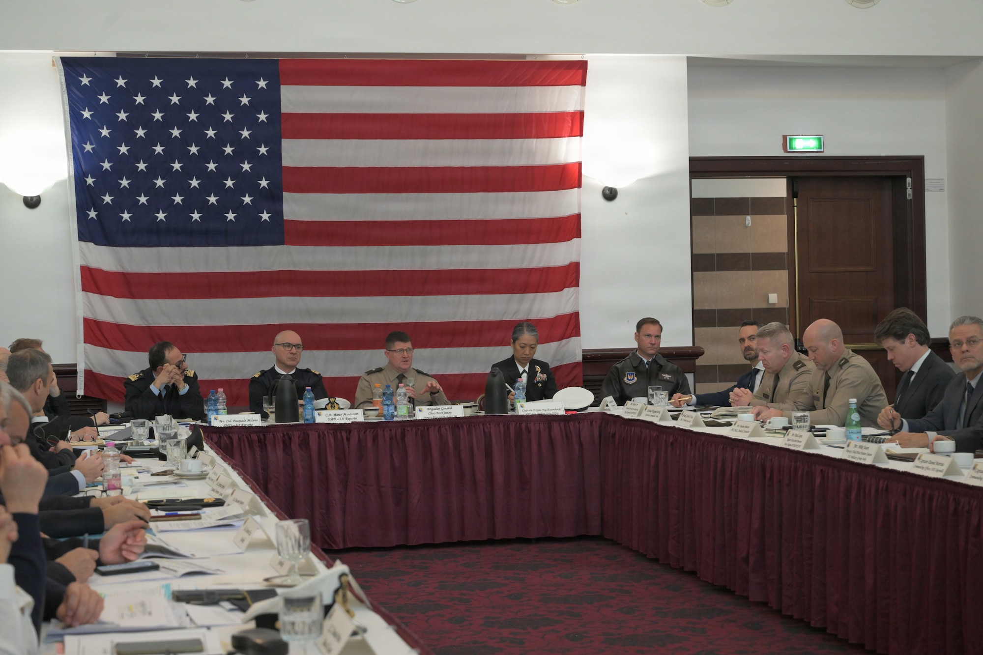 High ranking officials participate in a briefing.