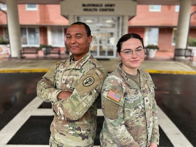 U.S. Army Sgt. Raven Maldonado, a combat medic specialist assigned to the Pediatric Clinic, and U.S. Army Sgt. Jaden Huston, a combat medic specialist assigned to McDonald Army Health Center, pose for a photo at Joint Base Langley-Eustis, Va., Dec. 23, 2025. Maldonado and Huston were selected for the Army Medical Department Enlisted Commissioning Program (AECP), which enables enlisted Soldiers to earn a Bachelor of Science in Nursing and commission as officers in the Army Nurse Corps.
