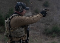 A U.S. Navy EOD technician fires a pistol during a live-fire exercise for Freezing Winds 25 in Finland on Nov. 25, 2025.