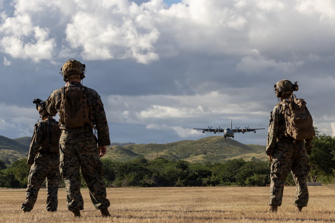 U.S. Marines with the Marine Air Traffic Control Mobile Team, 22nd Marine Expeditionary Unit (Special Operations Capable), guide a Marine KC-130J Super Hercules with Marine Aerial Refueler Transport Squadron (VMGR) 252, 2nd Marine Aircraft Wing, while conducting landing operations, at Camp Santiago, Puerto Rico, Jan. 10, 2026. This is the first time a KC-130J Super Hercules has landed on Landing Zone Collazo, marking an advancement in theater-level strategic assets. U.S. military forces are deployed to the Caribbean in support of the U.S. Southern Command mission, Department of War-directed operations, and the president’s priorities to disrupt illicit drug trafficking and protect the homeland. (U.S. Marine Corps photo)