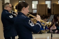 U.S. Air Force Master Sgt. Kristin Cazenave, trumpet player and noncommissioned officer in charge of priority events with The U.S. Air Force Band, performs alongside Tech. Sgt. Joshua Silva, trumpet player with The U.S. Air Force Band’s Ceremonial Brass, at St. Veronica’s Catholic School, Chantilly, Va., Jan. 13, 2026. Kazanave, one of the founding members of District Brass, helped create the program from her experience in the Air Force Regional Bands in Omaha, Neb., and Colorado Springs, Colo. (U.S. Air Force photo by Staff Sgt. Jordan Powell)