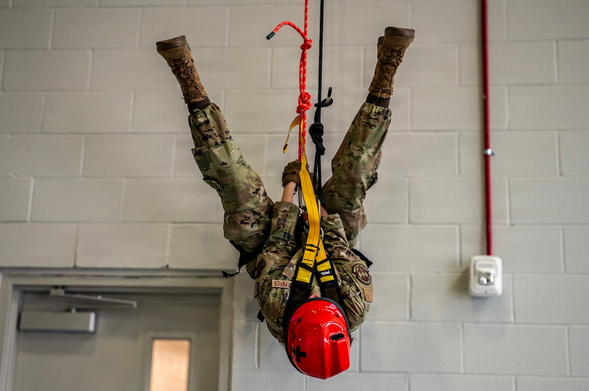 Tech. Sgt. Abigail Edwards, a search and extraction medic with the 121st Air Refueling Wing, is suspended during a rope confidence exercise at Rickenbacker Air National Guard Base, Columbus, Ohio, Jan. 10, 2026. The training builds the skills and confidence needed to extract injured personnel from difficult locations. (U.S. Air National Guard photo by Airman Samir Harris)