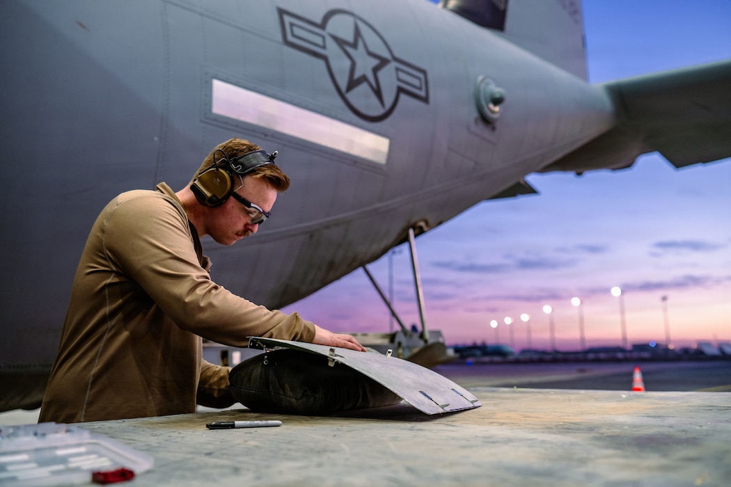 Airman working on a C-130