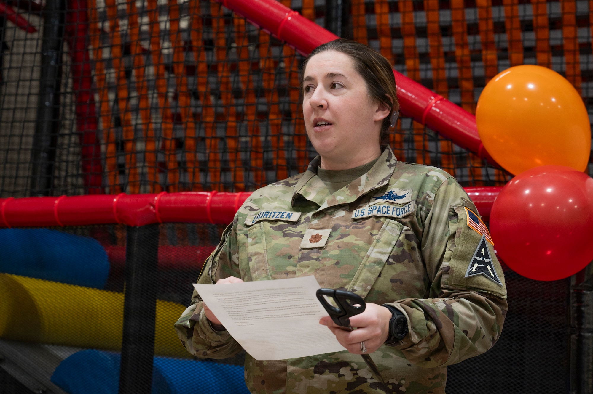 U.S. Space Force Maj. Lauren Lauritzen, 10th Space Warning Squadron deputy commander, thanks those who helped complete the play area project during a ribbon cutting ceremony at Cavalier Space Force Station, North Dakota, Jan. 9, 2026.