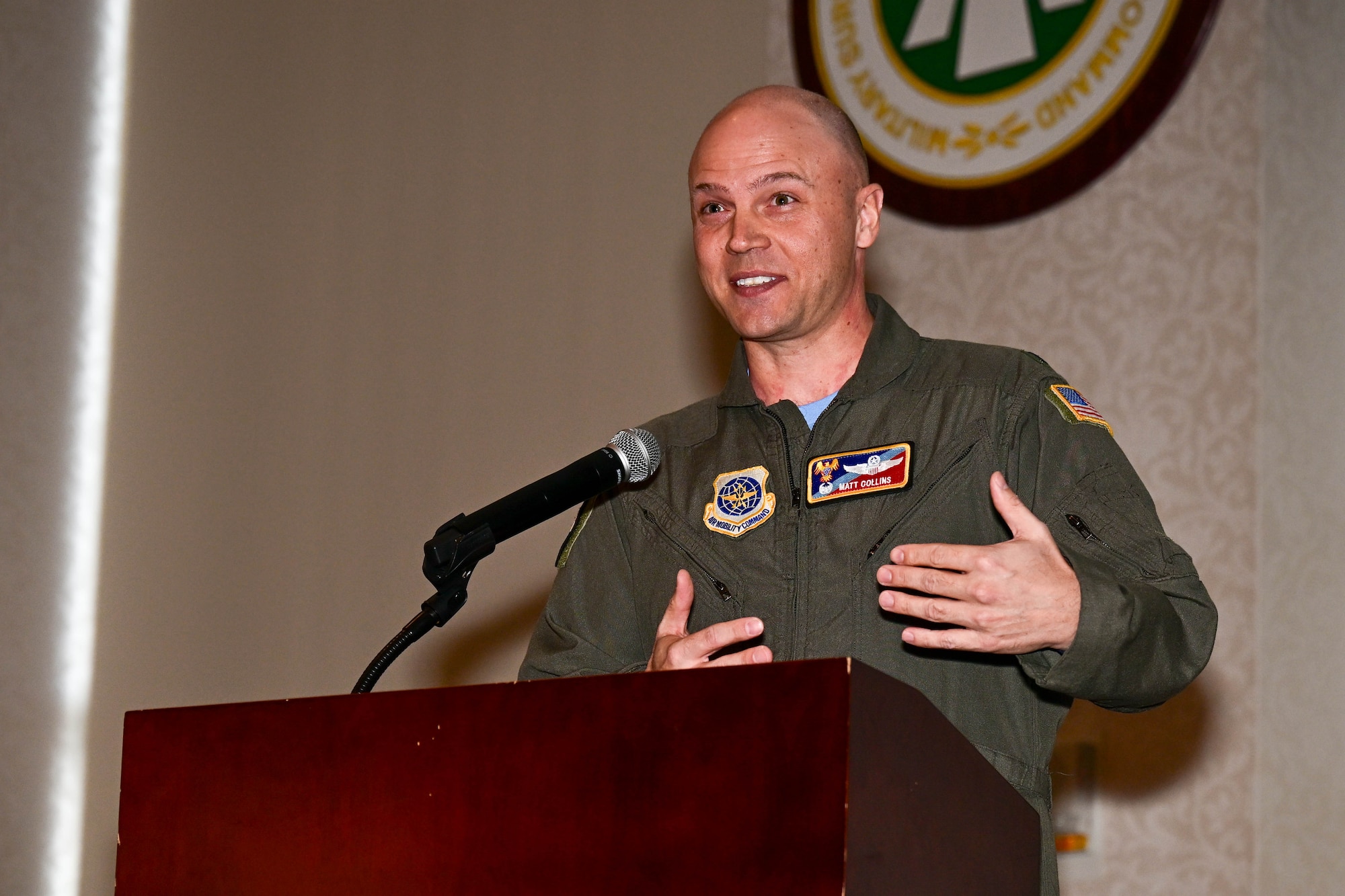 U.S. Air Force Lt. Col. Matt Collins speaking at a podium.