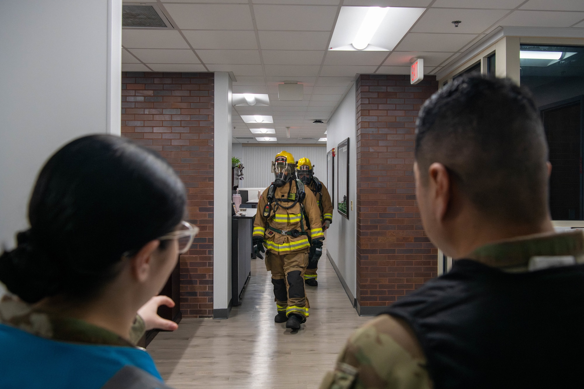 A photo of two service members inspecting the Civil Engineering Squadron