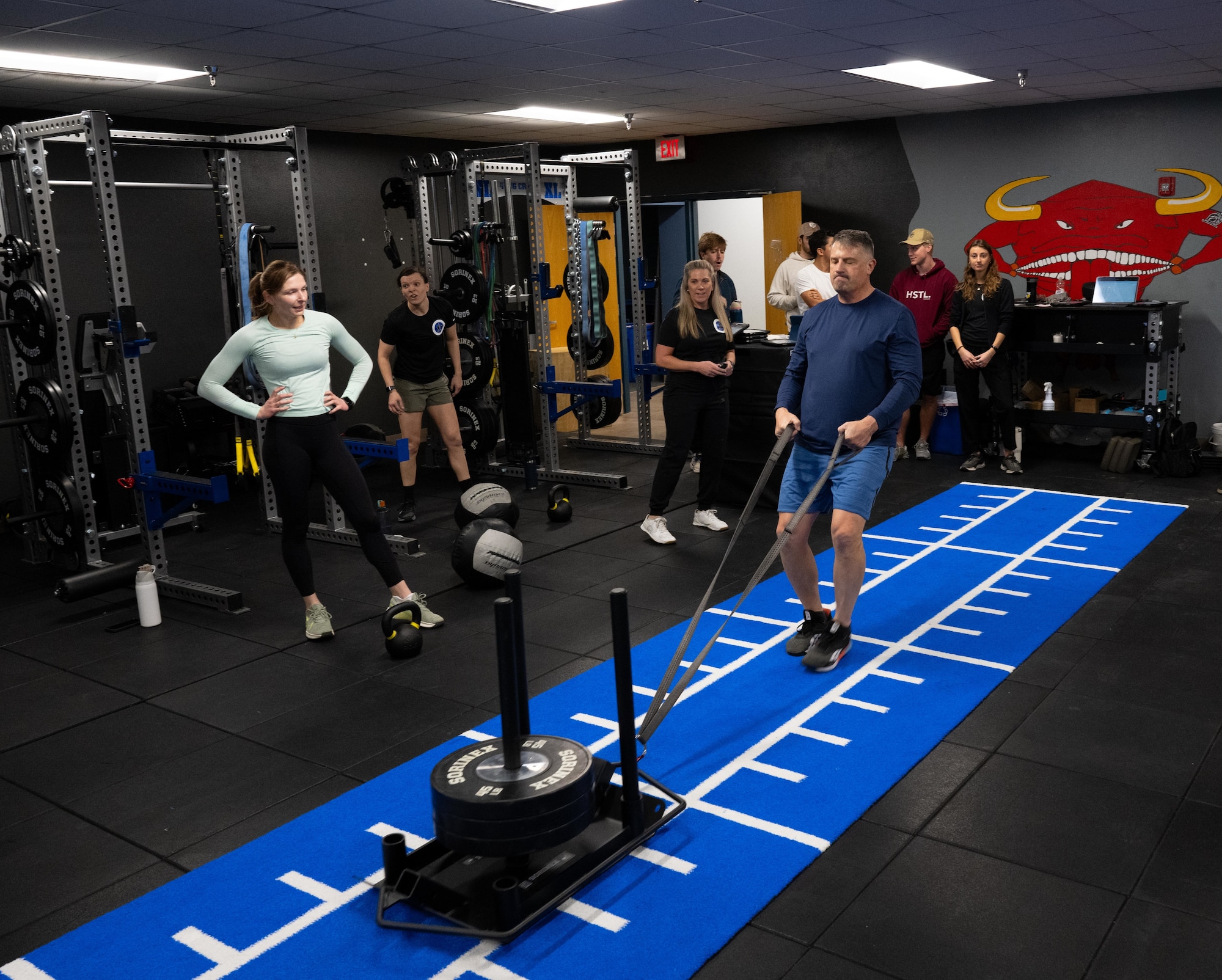 U.S. Air Force Col. Joseph McCane, 47th Operations Group commander, participates in the Comprehensive Readiness For Aircrew Flying Training CRAFT exercise performing a sleigh pull at the Tactical Athlete Center (TAC) at Laughlin Air Force Base, Texas, Jan. 12, 2025. Following a ribbon cutting event, base leadership participated in a CRAFT-led workout to experience firsthand how the TAC’s training supports pilot readiness and long-term durability.