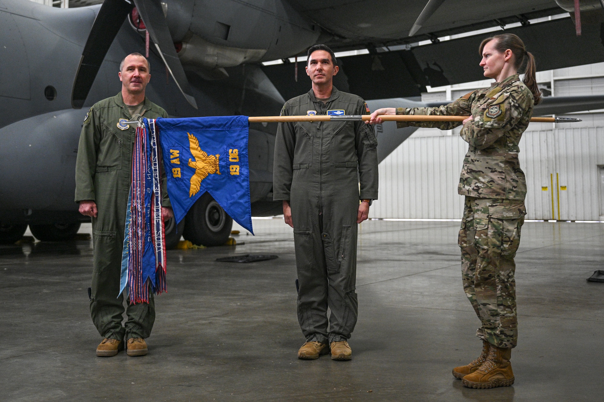 U.S. Air Force Airmen assigned to the 19th Airlift Wing unveil the 19th Operations Group guidon during a reactivation ceremony, Jan. 23, 2026, at Little Rock Air Force Base, Arkansas. As one of the Air Force’s first Units of Action, the 19th AW continues to play a key role in shaping how wings organize, train, and deploy to meet future operational demands.
