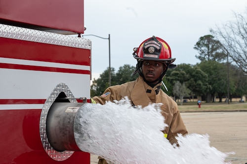 Staff Sgt. Kanaji Vason, a 42d Civil Engineering Squadron firefighter, verifies if the water pump works properly during training at Maxwell Air Force Base, Alabama, Jan. 22, 2026.