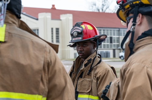 Staff Sgt. Kanahji Vason, a 42d Civil Engineering Squadron firefighter, talks with his teammates during a training at Maxwell Air Force Base, Alabama, Jan. 22, 2025.
