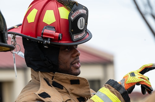Derek Dupree, a fire fighter assigned to the 42d Civil Engineering squadron, speaks with his teammates during Mobile Water Supply Operations training at Maxwell Air Force Base, Alabama, Jan. 22, 2026.