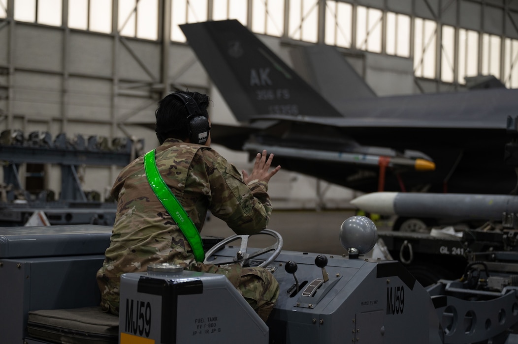U.S. Air Force Senior Airman Adrian Balderaz, 356th Fighter Generation Squadron weapons load crew member, competes in the 2026 Annual Load Competition at Eielson Air Force Base, Alaska, Jan. 23, 2026.
