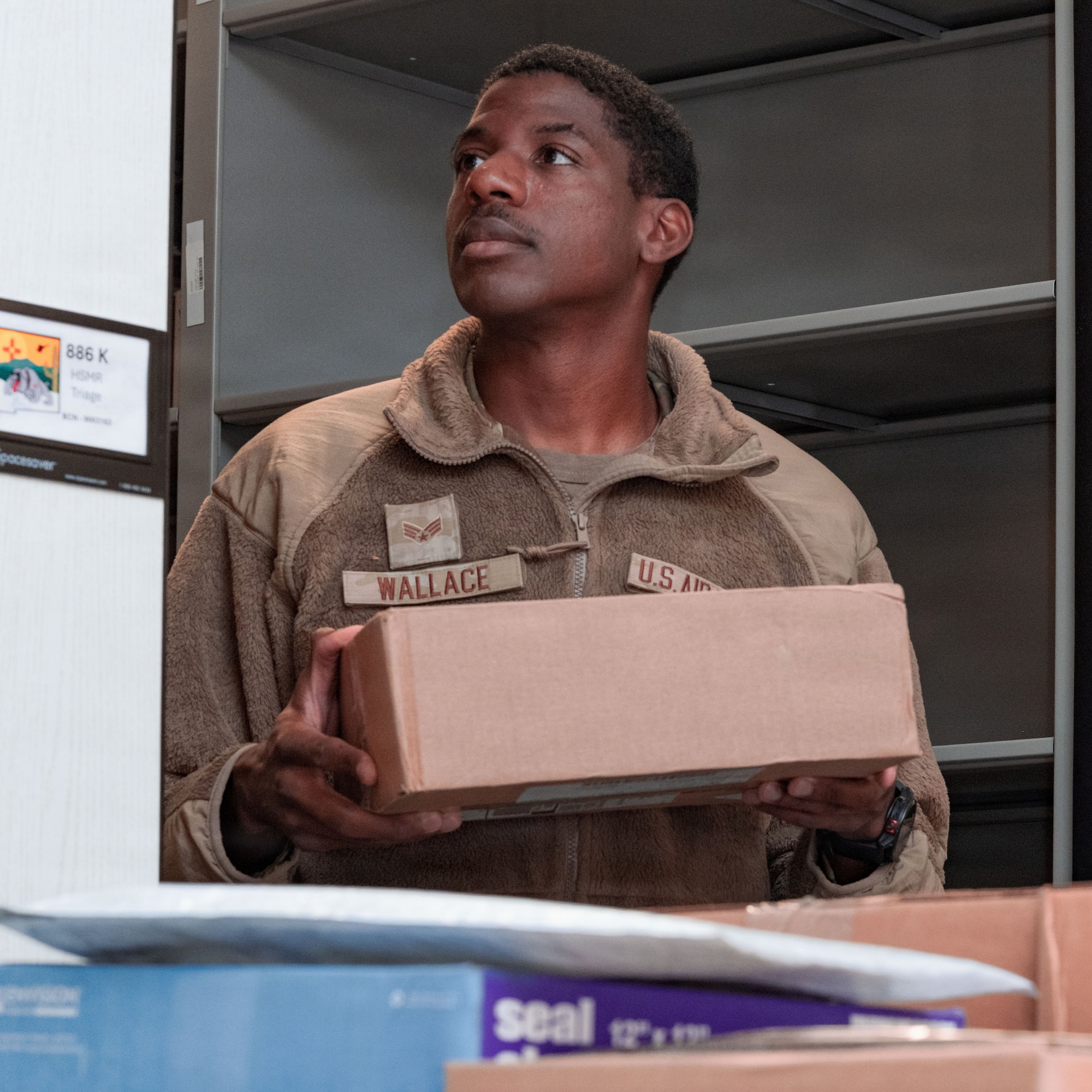 U.S. Air Force Senior Airman Dale Wallace II, Holloman Healthcare Operations Squadron warehouse technician journeyman, sorts packages of medical supplies at Holloman Air Force Base, New Mexico, Jan. 13, 2026.