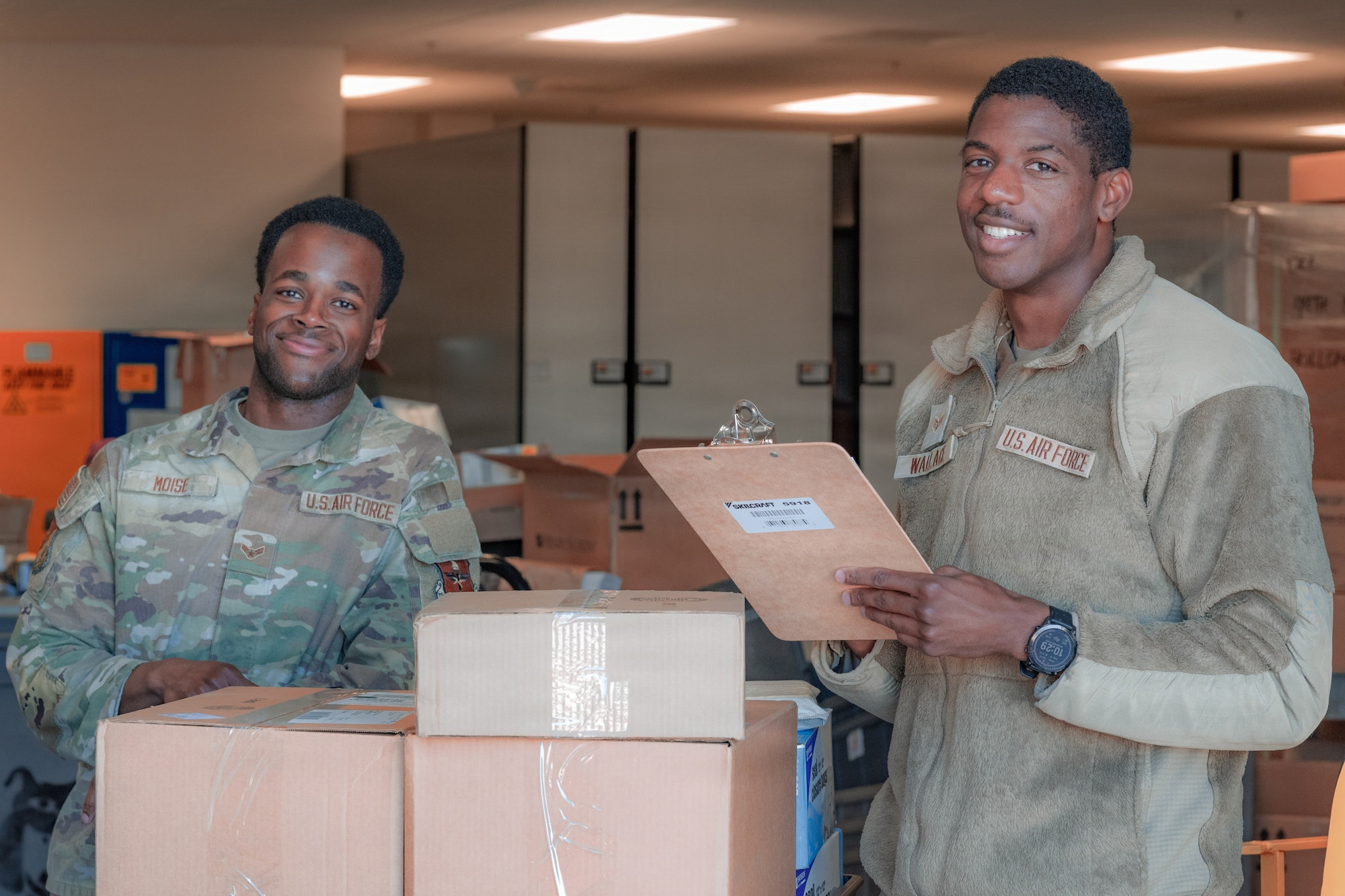 U.S. Air Force Airman 1st Class Fred Moise, Holloman Healthcare Operations Squadron warehouse technician journeyman, left, and U.S. Air Force Senior Airman Dale Wallace II, warehouse technician journeyman, pose for a photo at Holloman Air Force Base, New Mexico, Jan. 13, 2026.